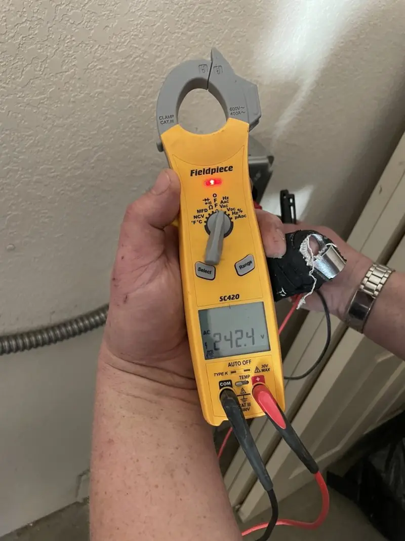 Voltage testing with clamp meter during Generator Installation in Happy Valley